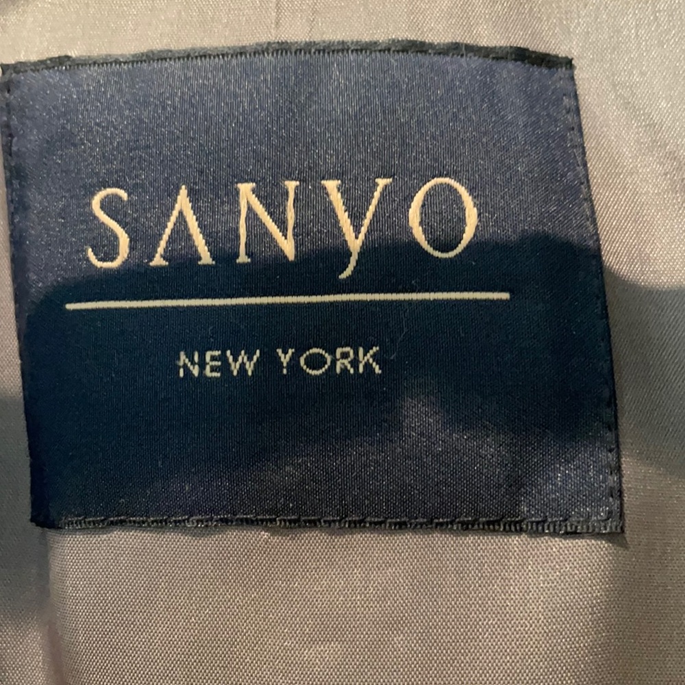 Elegant trench coat by Sanyo.  R-40 size